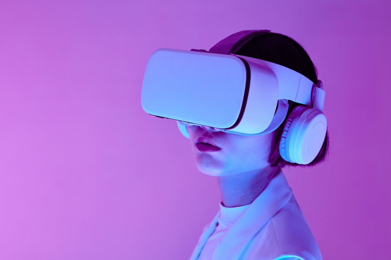 who-we-are Woman explores virtual reality with VR goggles in modern studio light.